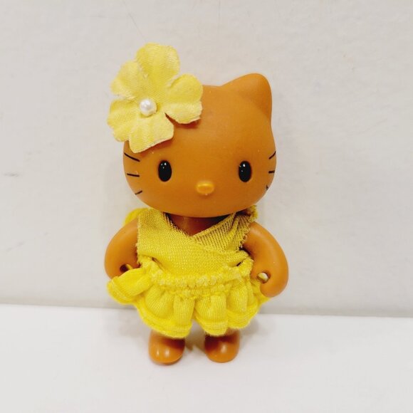 2002 Hello Kitty Sun Tan Brown Floral Yellow Aloha Sanrio Mini PVC Figure RARE - Picture 1 of 5